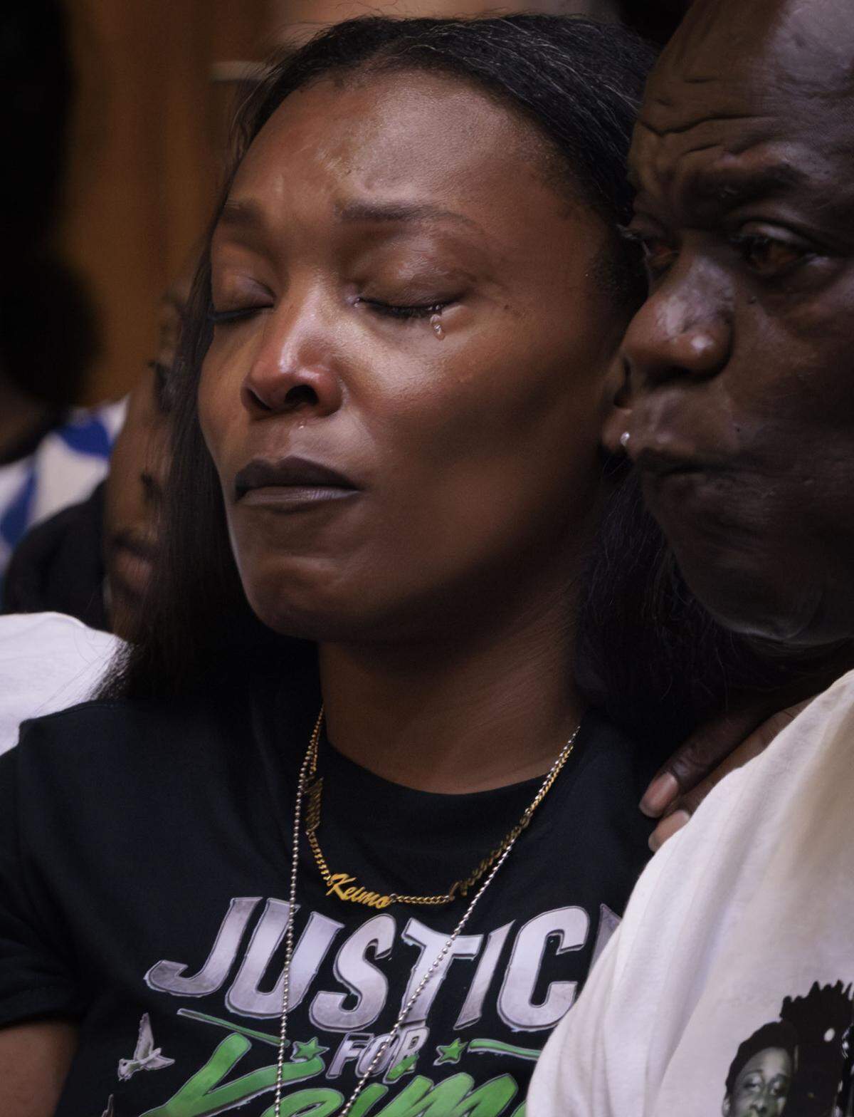 Nathalie Jean cries on Tuesday, May 5, 2026, while watching a video of her son’s death. 